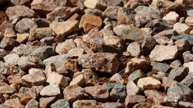 Small Irregularly Shaped Rocks And Gravel Scattered On The Ground